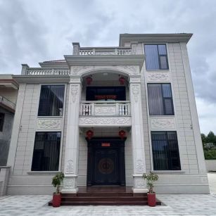 葫芦岛 芝麻白石材别墅干挂案例展示